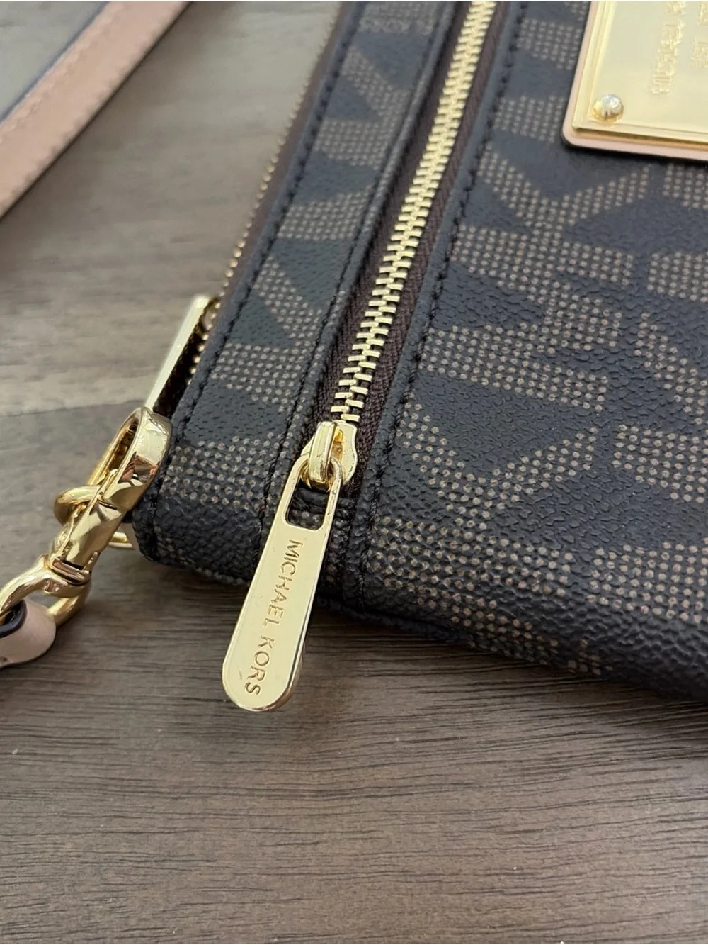 Michael Kors Brown and Tan MK Logo Wristlet with Gold Plate